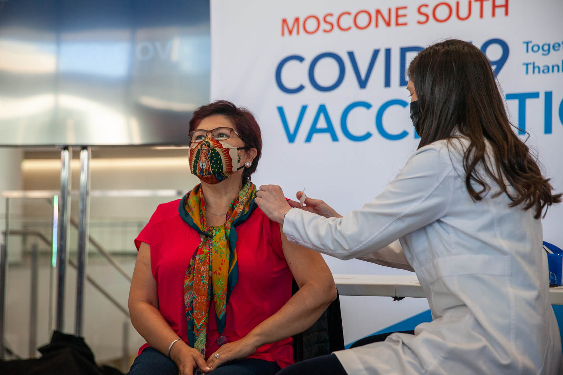 Photo of woman getting Covid-19 vaccination