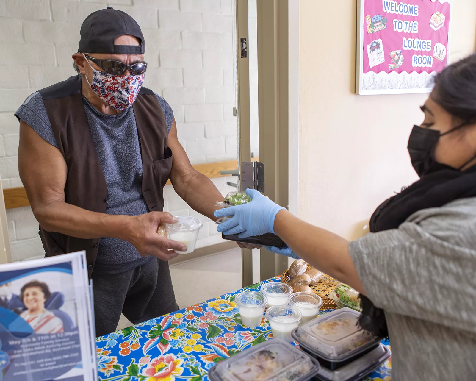 Man receiving meal from food program