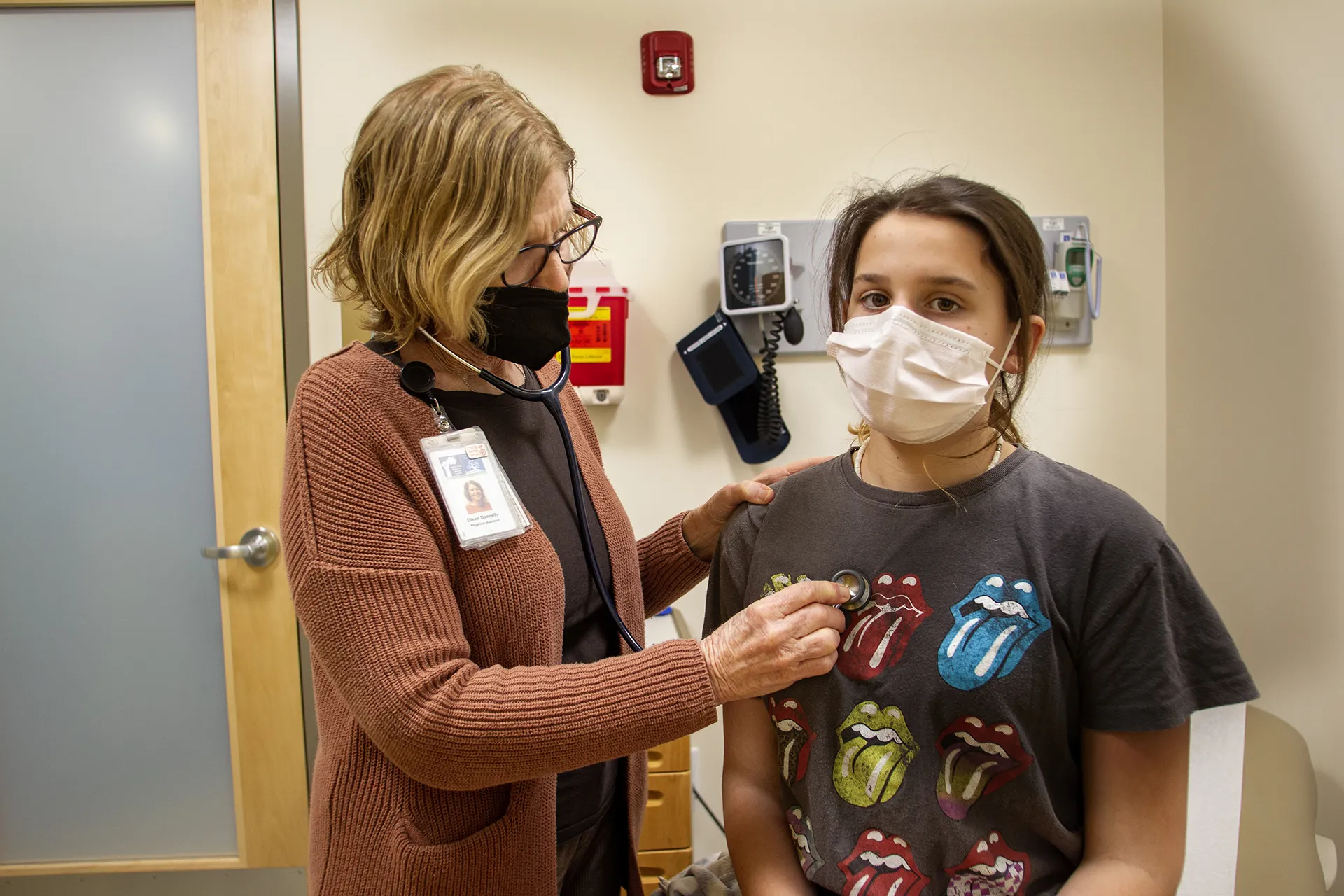 Doctor examining teen