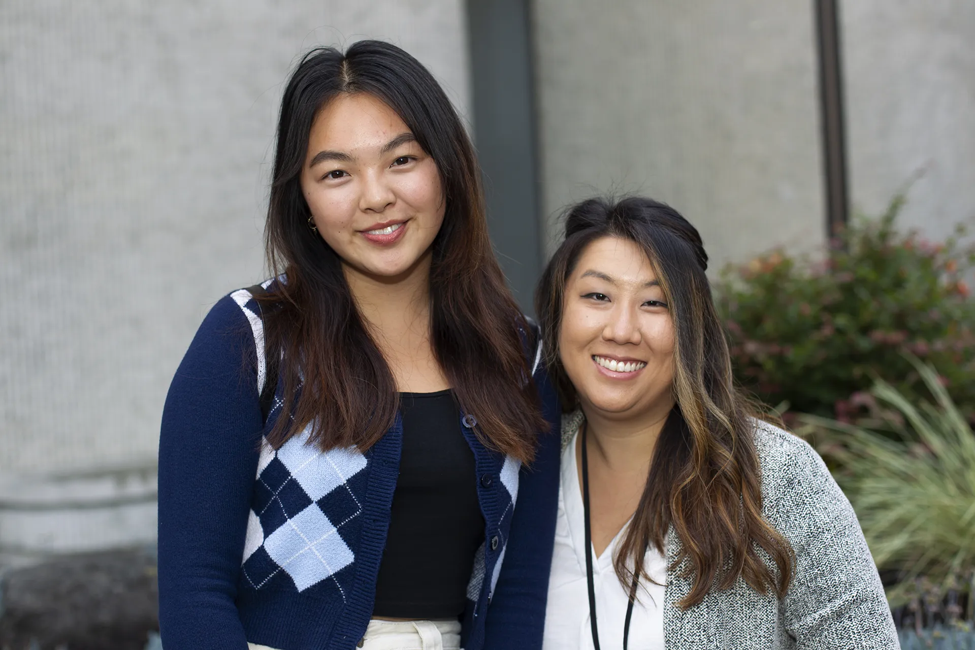 Two Asian American students smiling